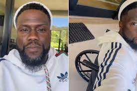 kevin hart in a wheelchair after racing an NFL friend