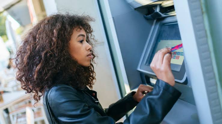 Woman using the ATM 
